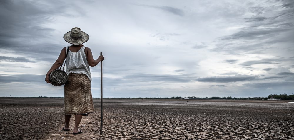 women-standing-on-dry-soil-and-fishing-gear-globa-2023-11-27-05-20-14-utc